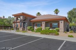 7701 West Robindale Road, Unit 277 Las Vegas, NV 89113 - Photo 27 of 33 A well-maintained clubhouse welcomes residents with its inviting facade and convenient parking.