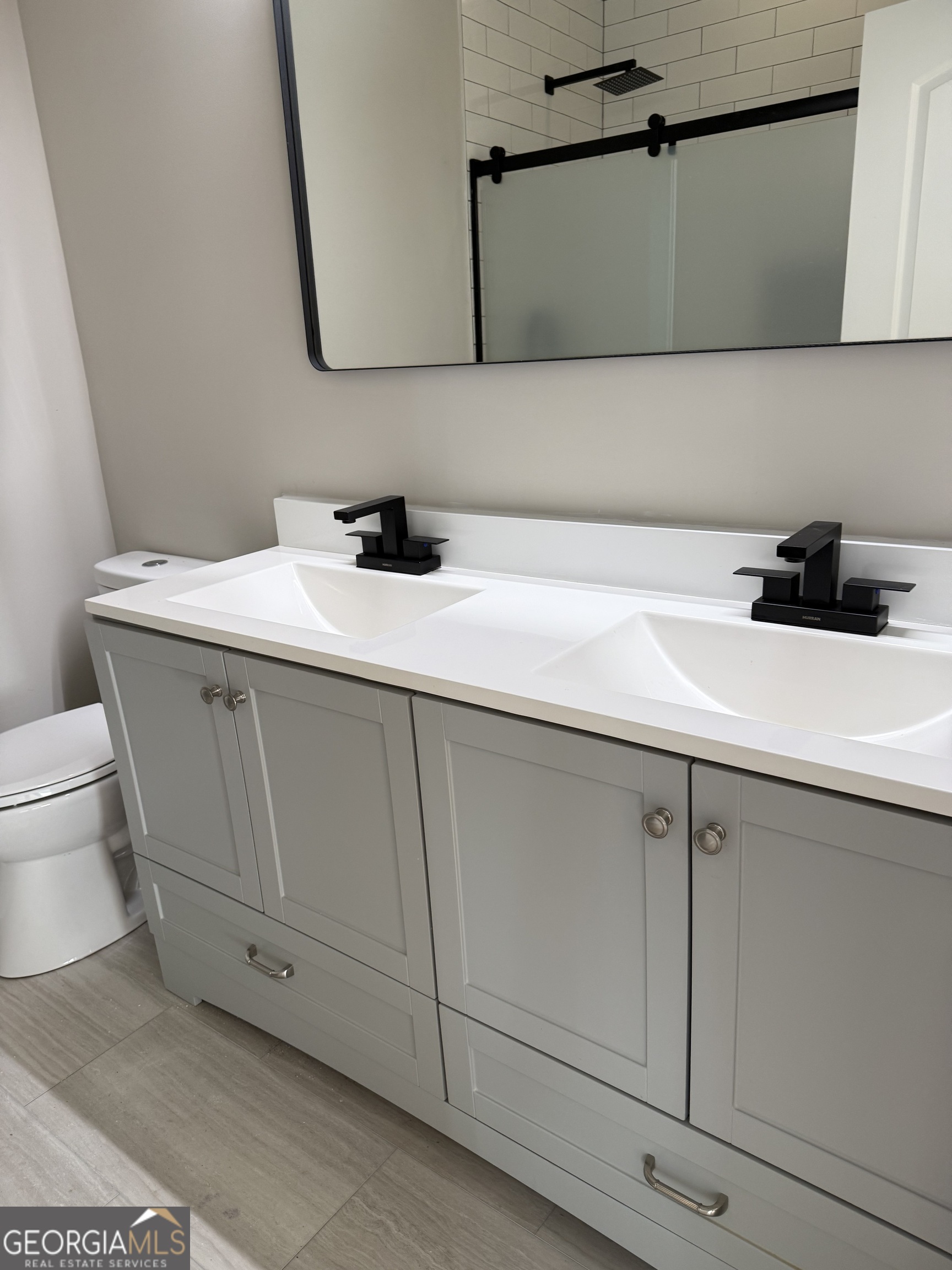 2 Cedar Avenue Griffin, GA 30223 - Photo 12 of 13 a bathroom with a sink and a toilet