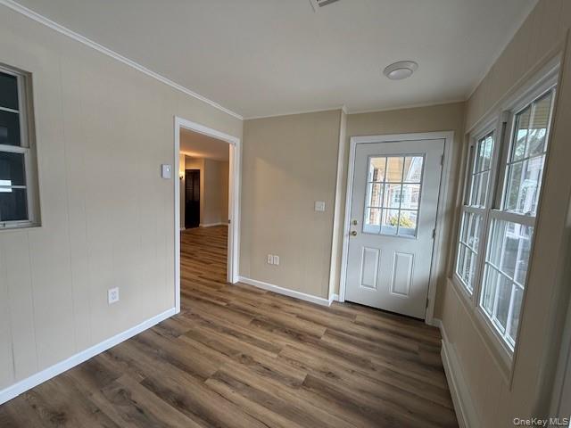 373 Woodbridge Drive, Unit B Ridge, NY 11961 - Photo 17 of 23 a view of an empty room with wooden floor and a window