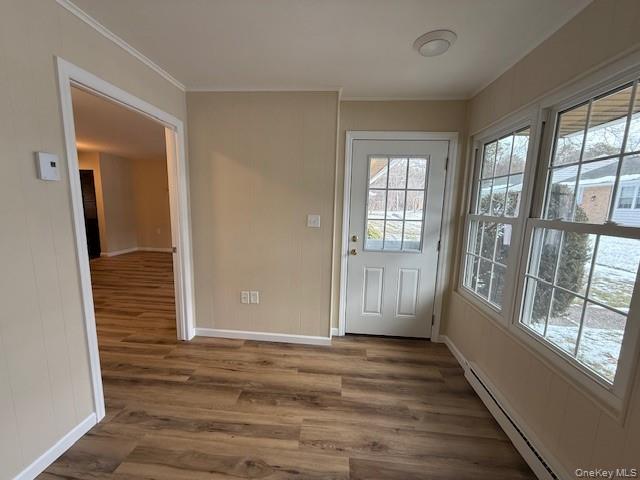 373 Woodbridge Drive, Unit B Ridge, NY 11961 - Photo 19 of 25 Sunroom with Doorway to outside New wood finished floors, and crown molding