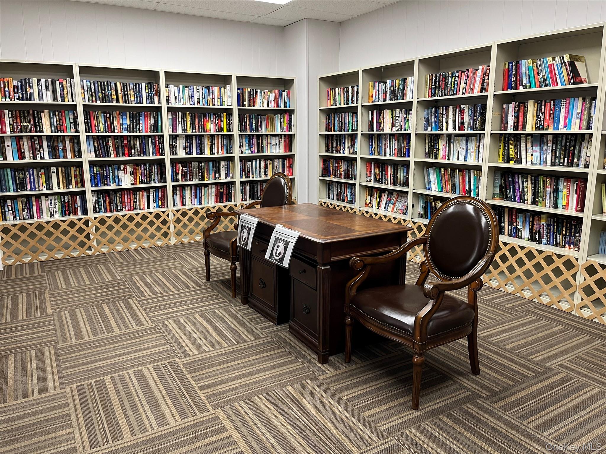 373 Woodbridge Drive, Unit B Ridge, NY 11961 - Photo 24 of 25 Library in the Clubhouse Building