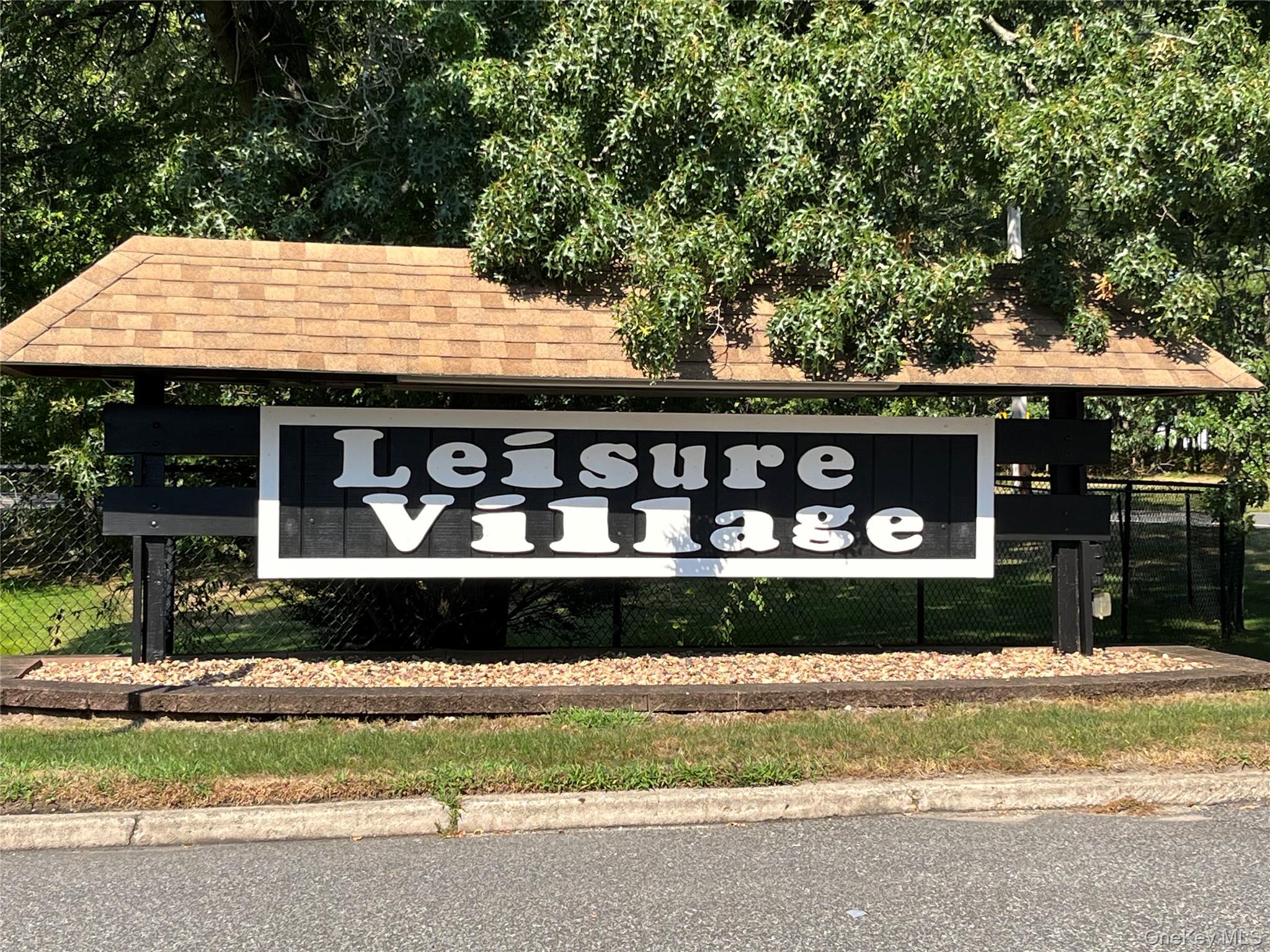 373 Woodbridge Drive, Unit B Ridge, NY 11961 - Photo 25 of 25 View of community / neighborhood sign