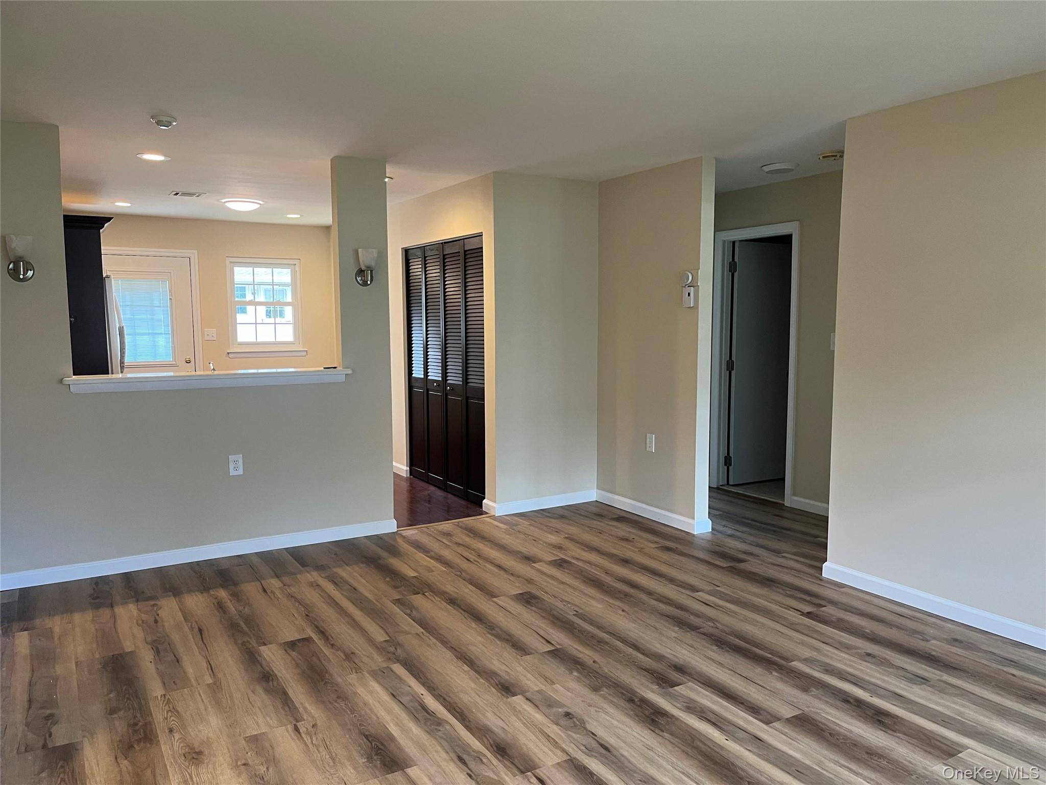 373 Woodbridge Drive, Unit B Ridge, NY 11961 - Photo 9 of 25 View from Living Room to Kitchen Opening