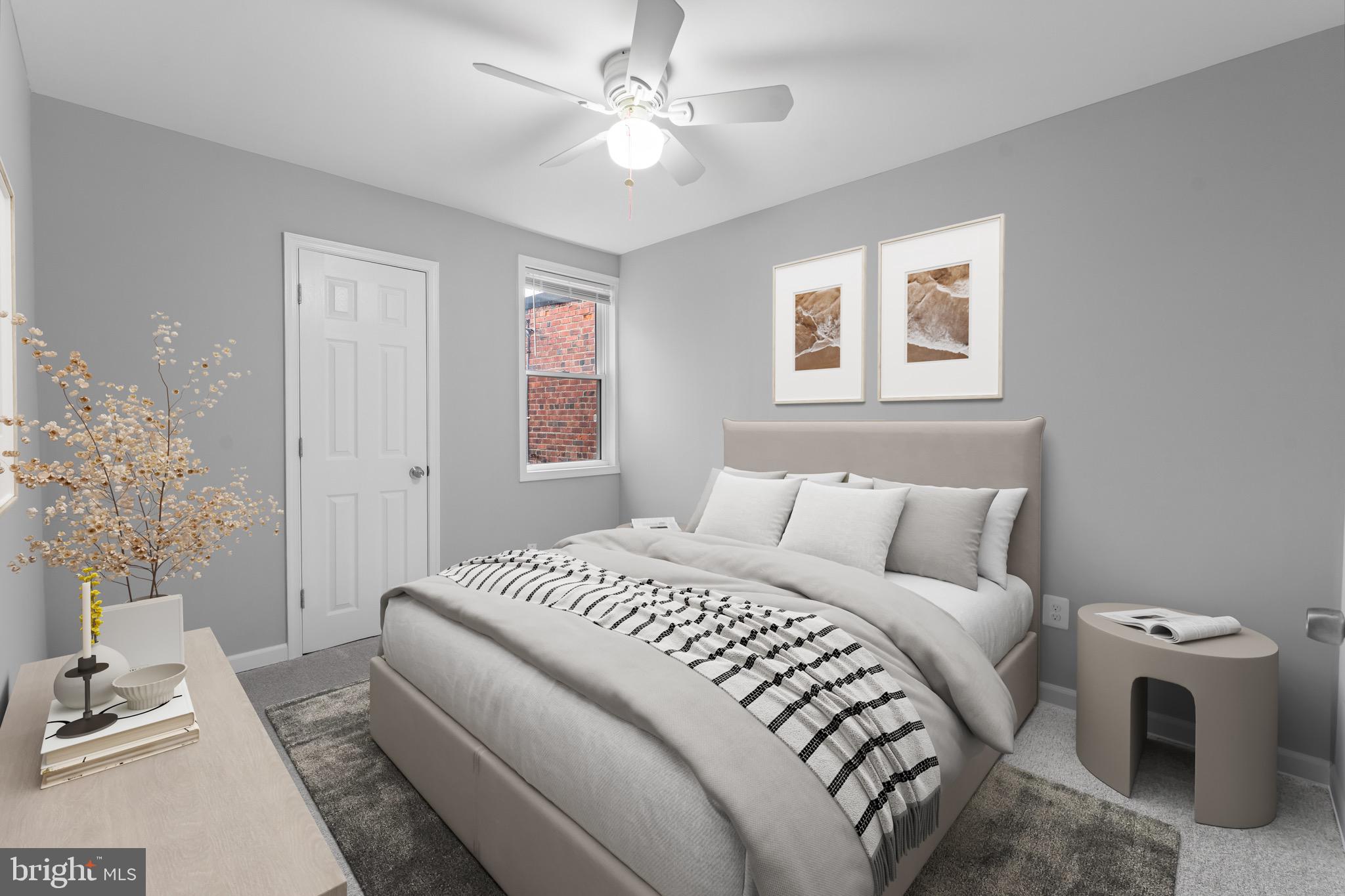 3904 Woodridge Road Baltimore, MD 21229 - Photo 11 of 17 a bedroom with a white bed and a window