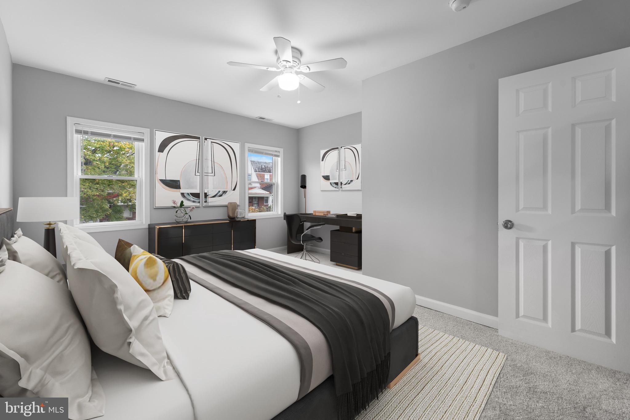 3904 Woodridge Road Baltimore, MD 21229 - Photo 12 of 17 a bedroom with double bed and a chandelier