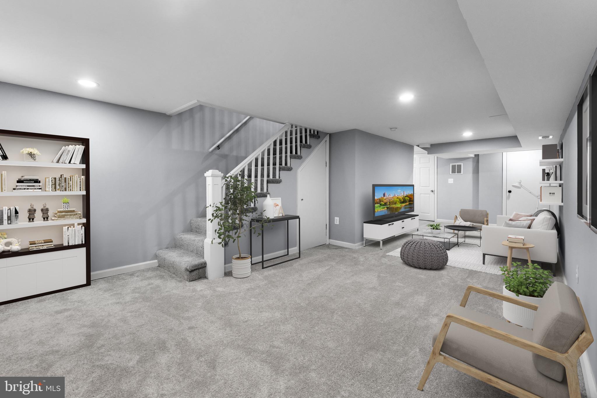 3904 Woodridge Road Baltimore, MD 21229 - Photo 13 of 17 a living room with furniture and a flat screen tv