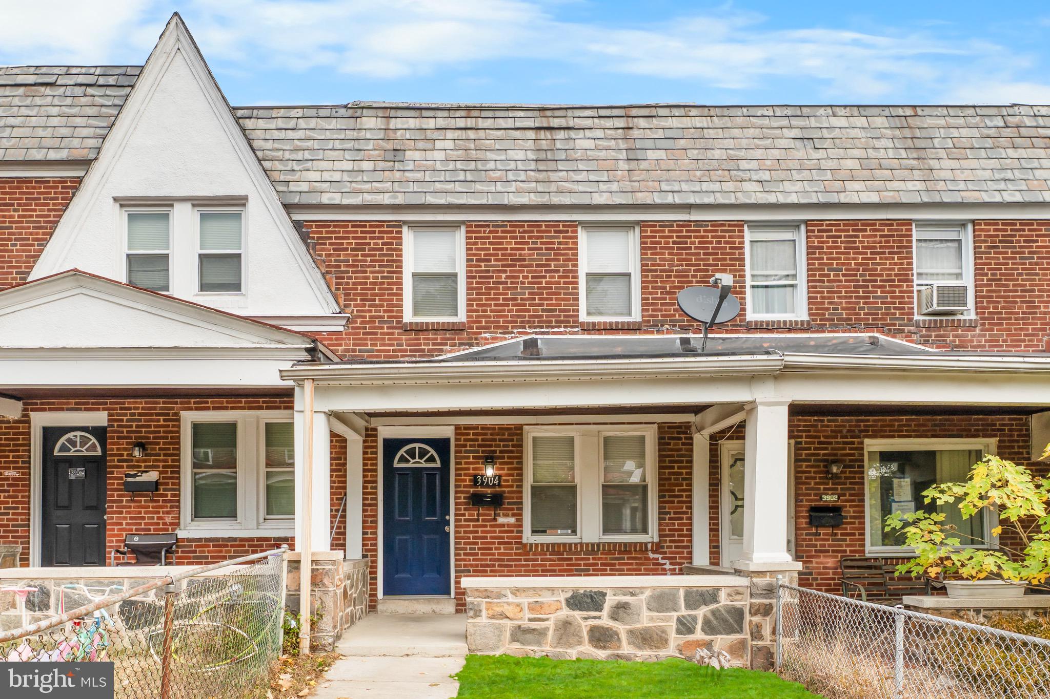 3904 Woodridge Road Baltimore, MD 21229 - Photo 2 of 17 front view of a brick building
