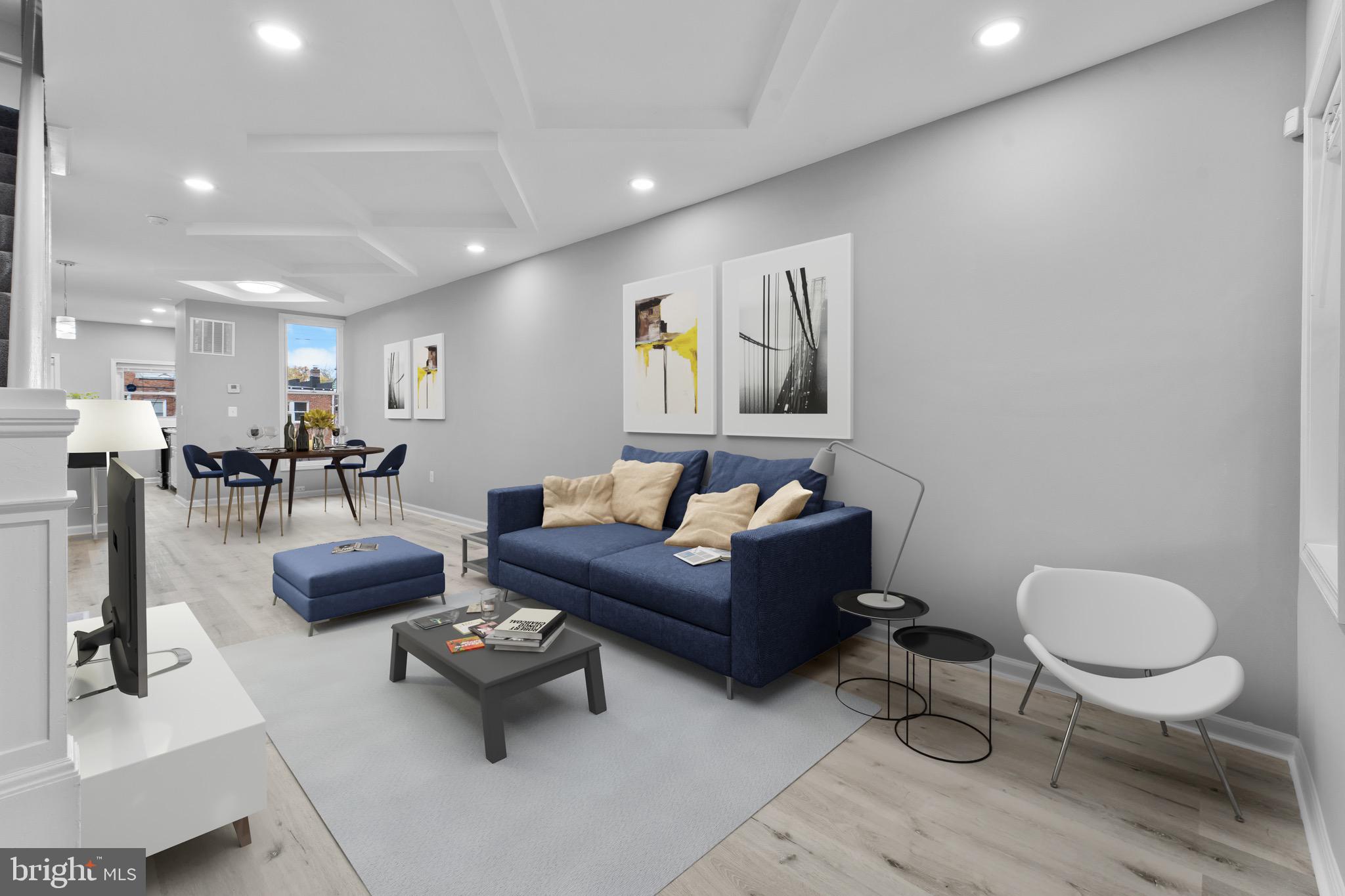 3904 Woodridge Road Baltimore, MD 21229 - Photo 4 of 17 a living room with furniture and a dining table with kitchen view