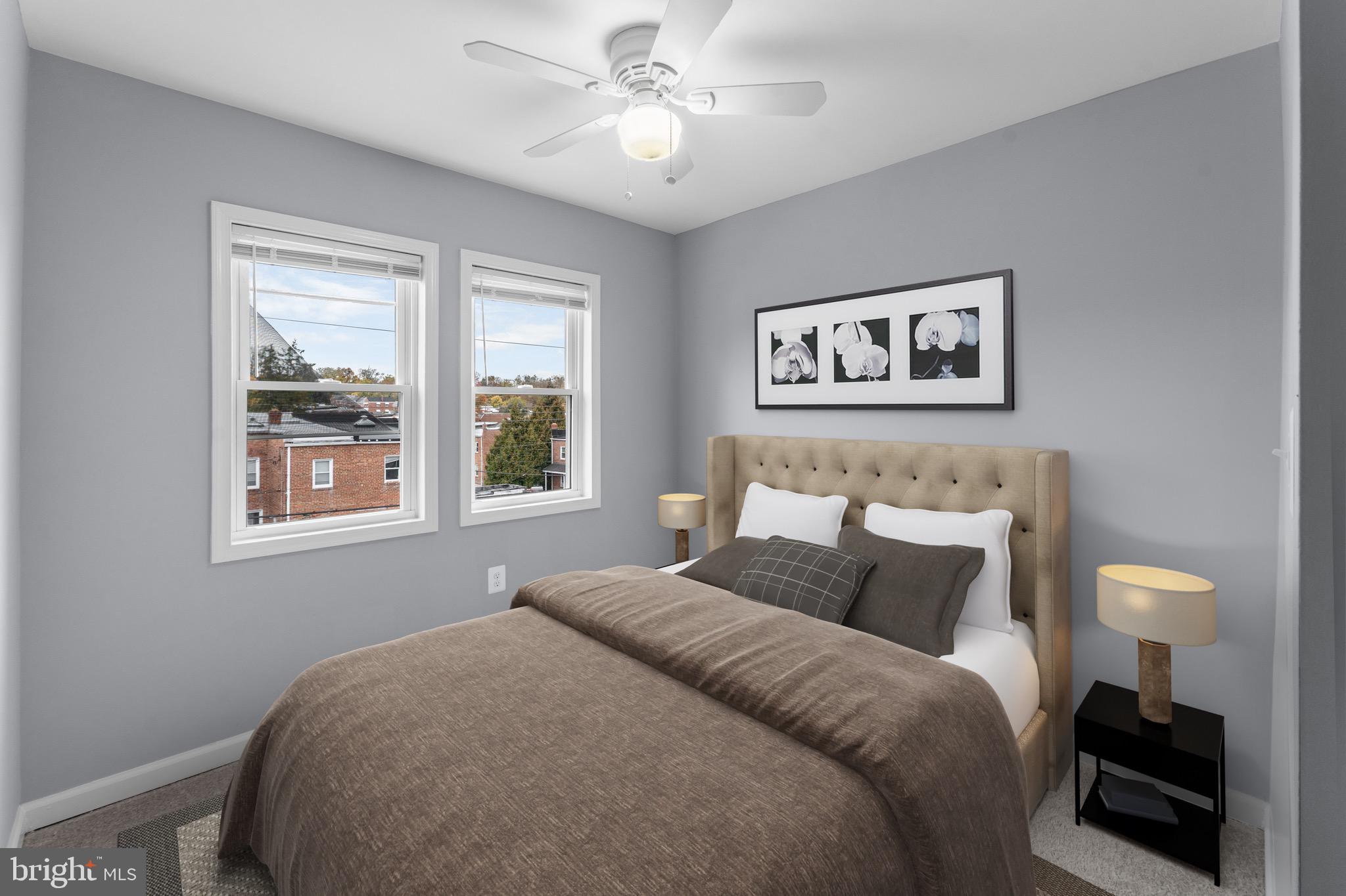 3904 Woodridge Road Baltimore, MD 21229 - Photo 10 of 17 a bedroom with a bed and a painting on the wall