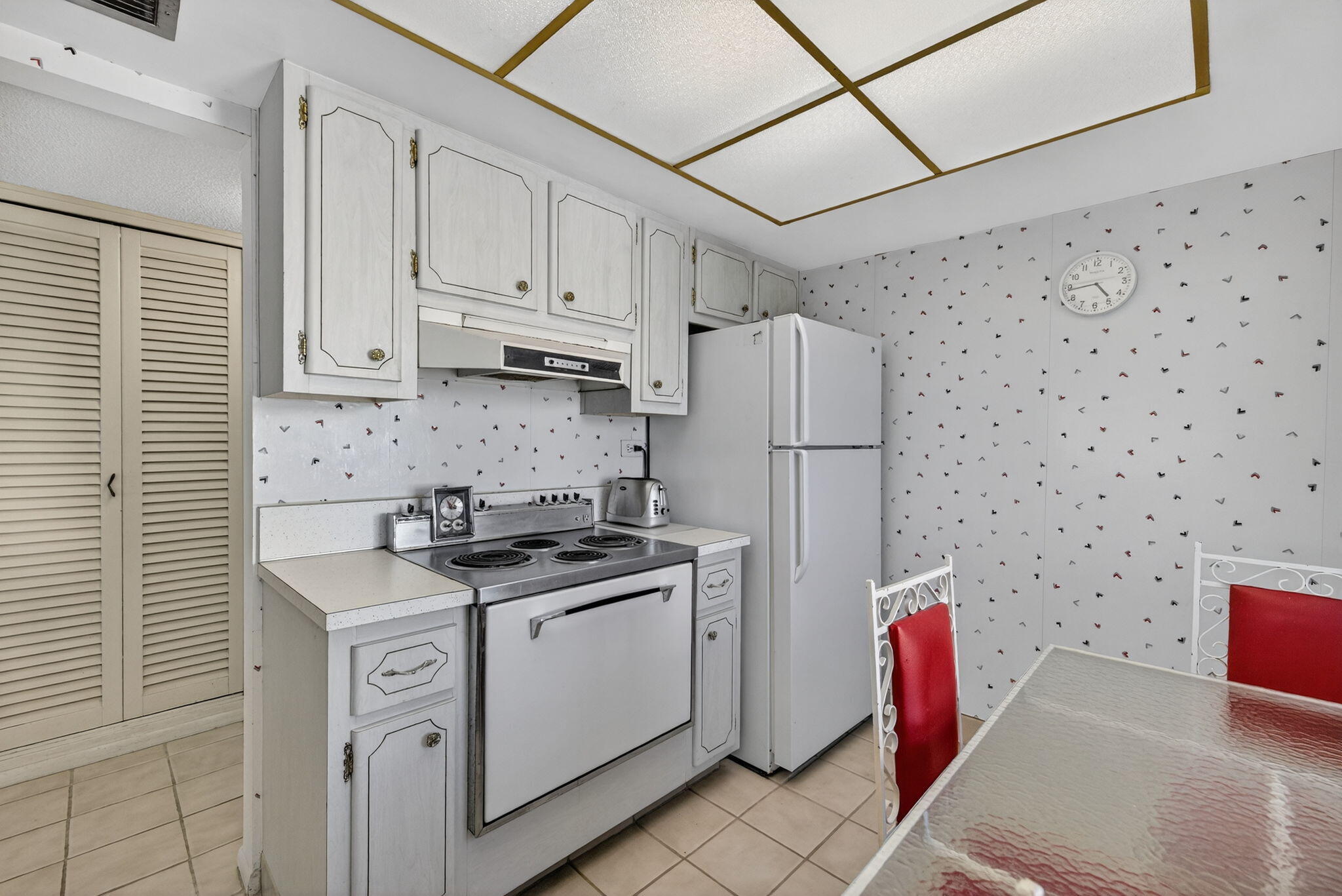 1069 Hillsboro Mile, Unit 802 Hillsboro Beach, FL 33062 - Photo 12 of 47 a kitchen with stainless steel appliances a refrigerator sink and cabinets
