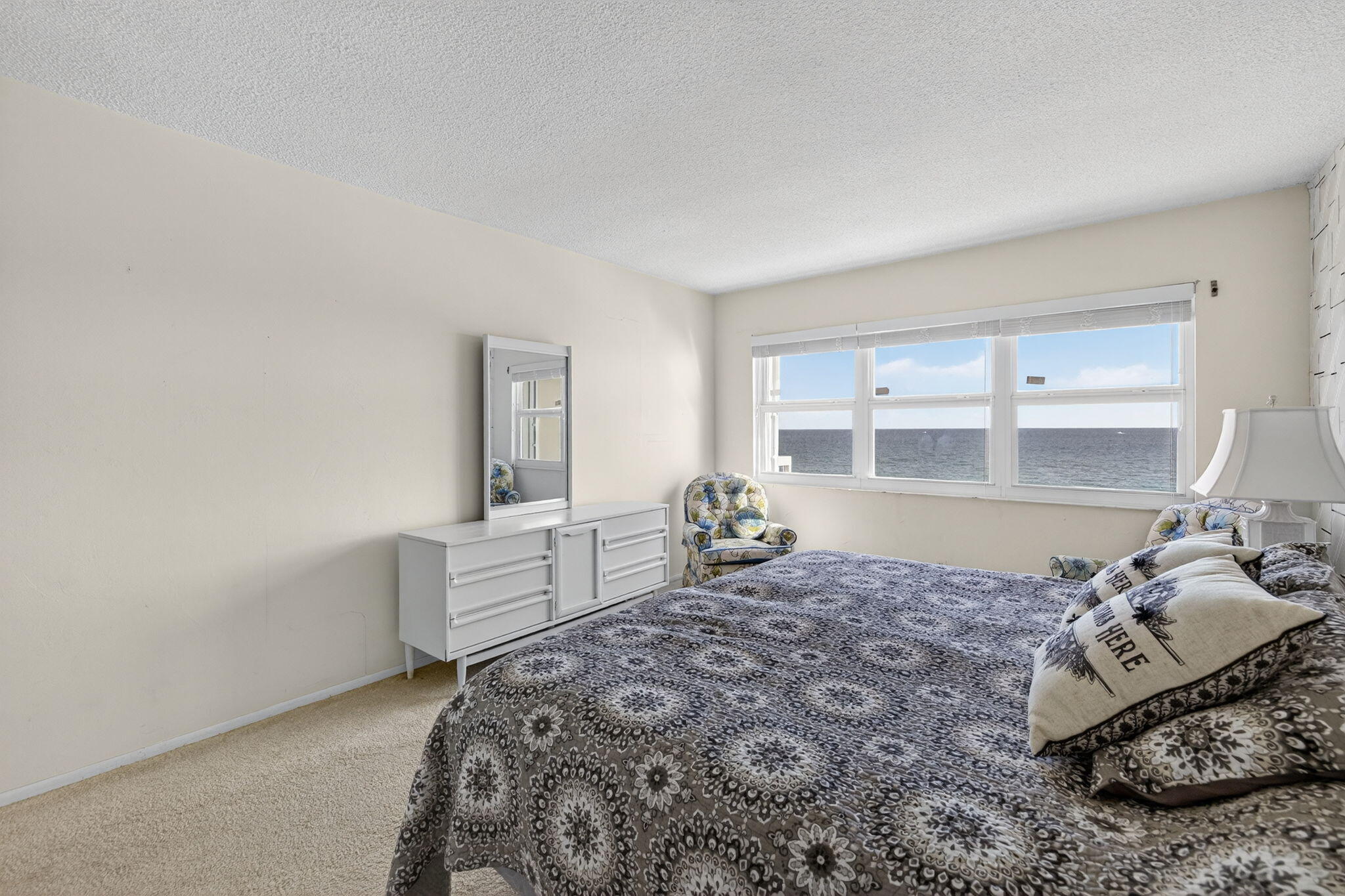 1069 Hillsboro Mile, Unit 802 Hillsboro Beach, FL 33062 - Photo 14 of 47 a bedroom with a bed and a window