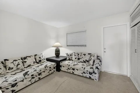 a bed room with furniture and a lamp