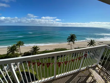 a view of a balcony with an ocean view