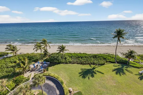 a view of a swimming pool with outdoor seating
