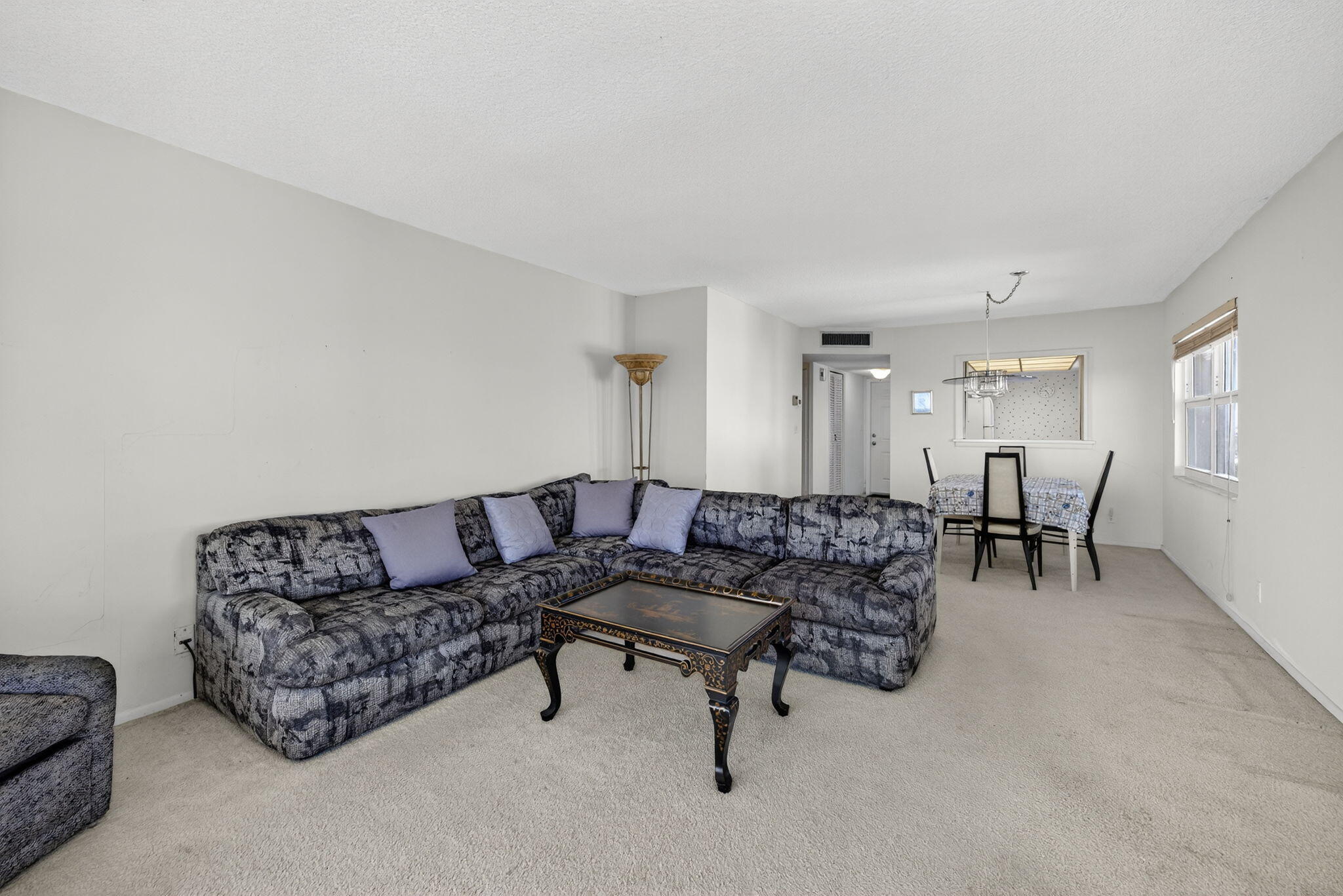 1069 Hillsboro Mile, Unit 802 Hillsboro Beach, FL 33062 - Photo 8 of 47 a living room with furniture and a table