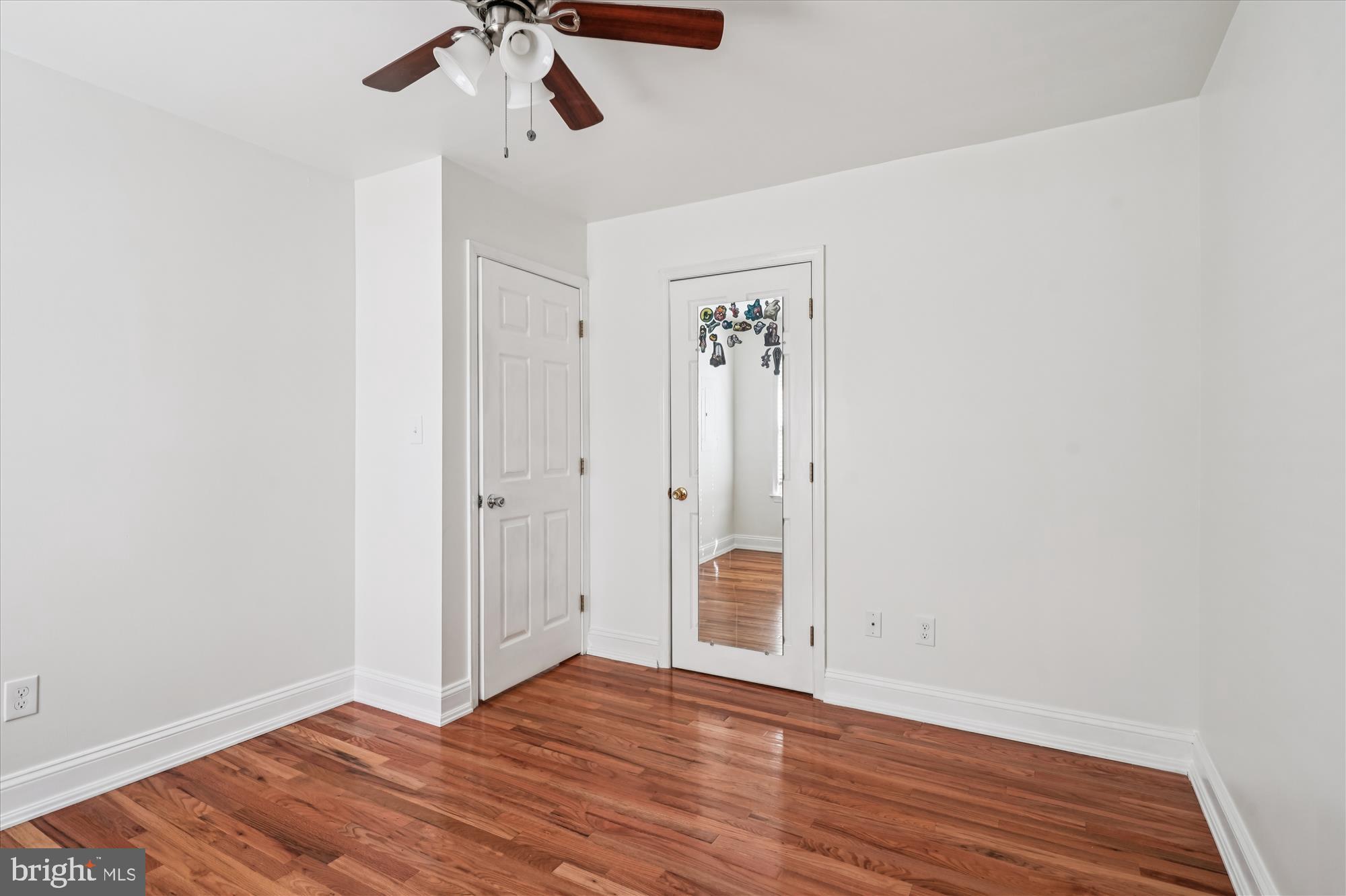 3831 8th Street North Beach, MD 20714 - Photo 18 of 37 a view of an empty room with wooden floor