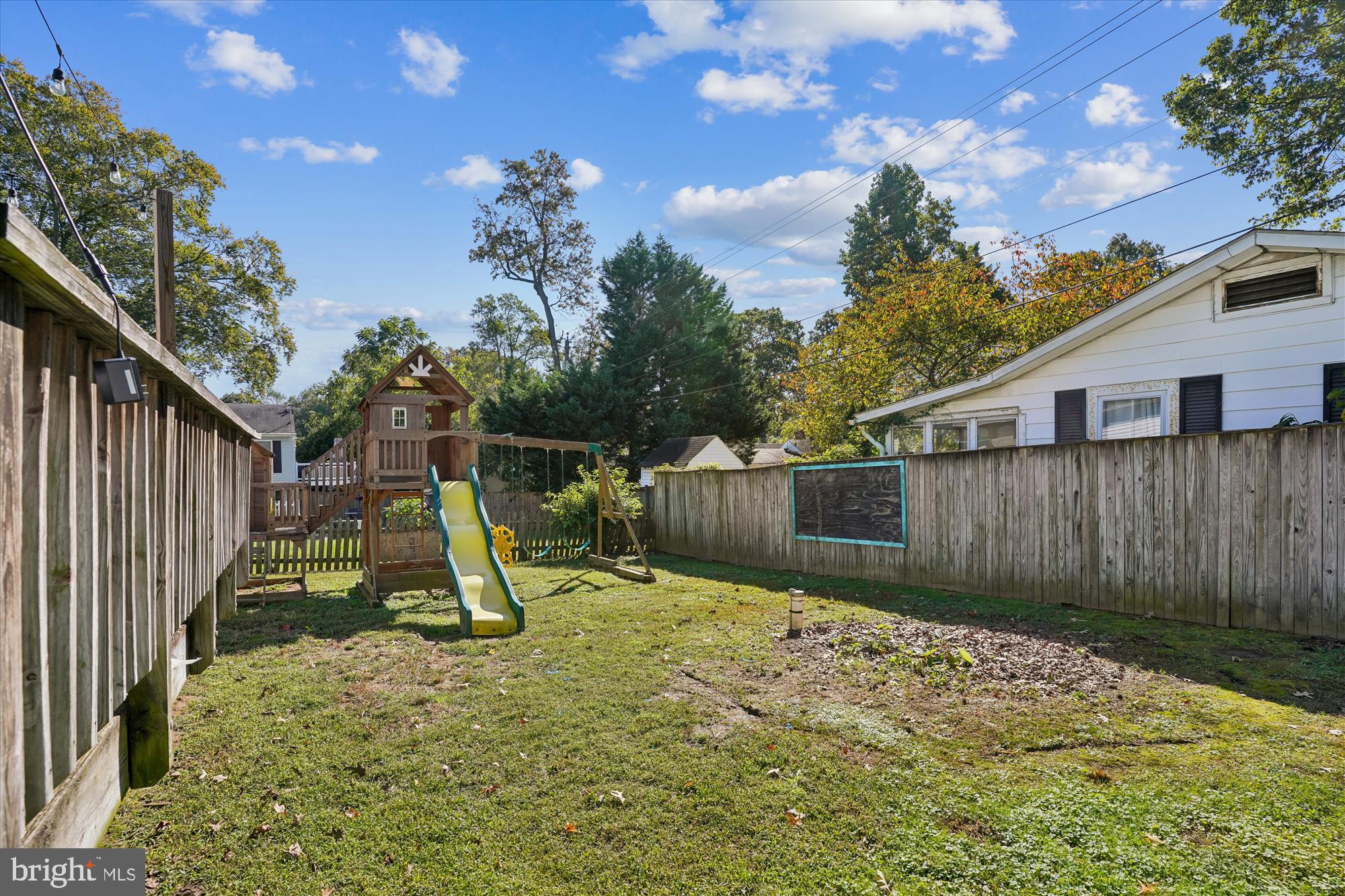 3831 8th Street North Beach, MD 20714 - Photo 26 of 37 a view of a backyard with a slide