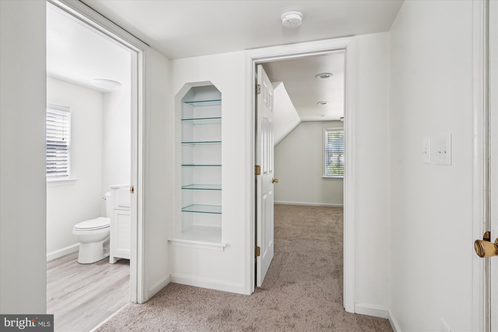 3831 8th Street North Beach, MD 20714 - Photo 9 of 37 a bathroom with a toilet and a sink