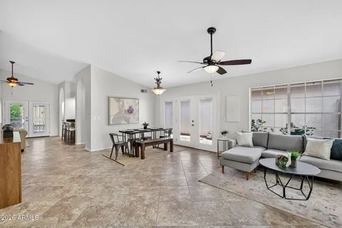 a living room with furniture and a large window