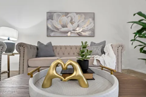 a living room with furniture and a potted plant