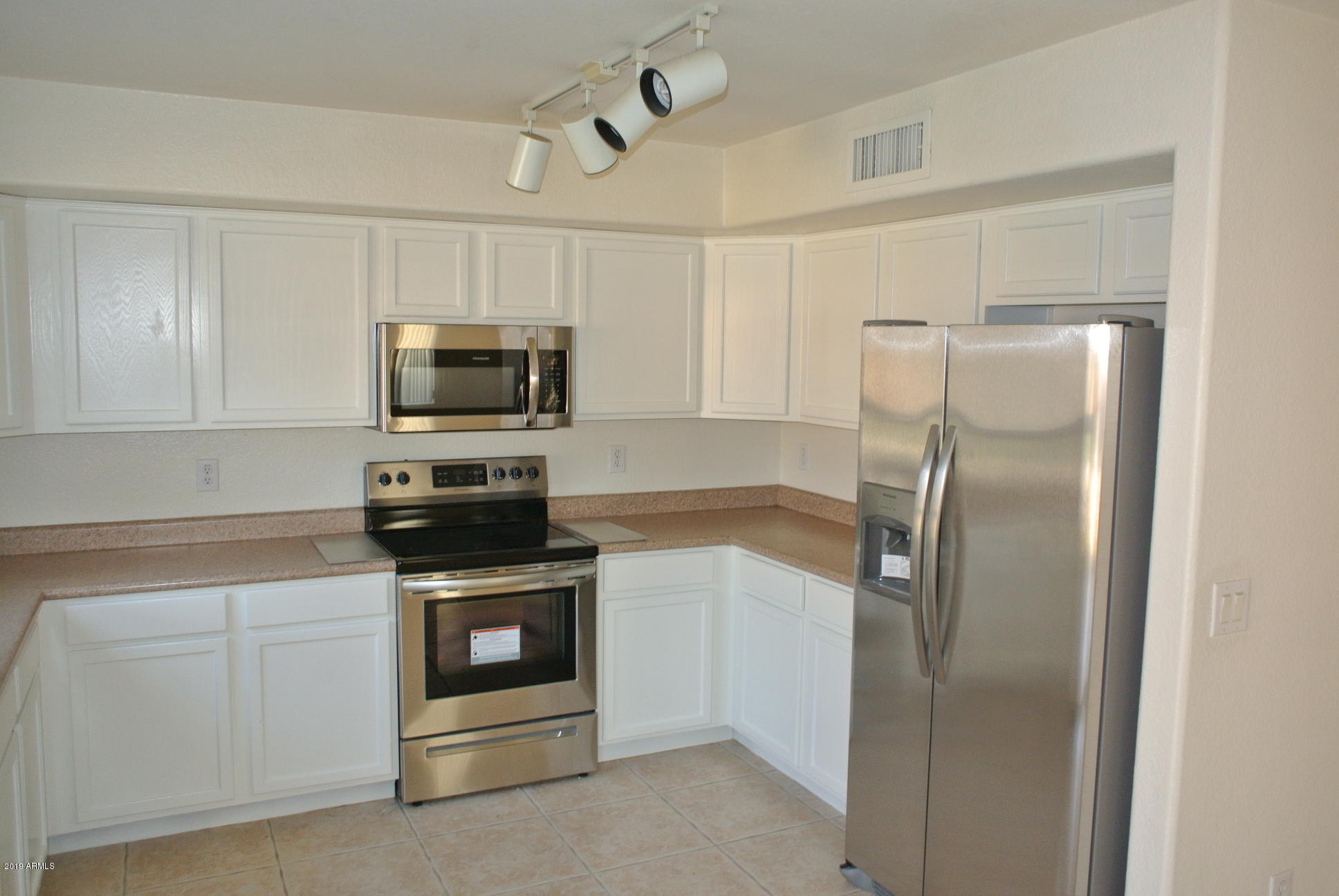 2534 West Red Fox Road Phoenix, AZ 85085 - Photo 15 of 24 Kitchen with Fridge