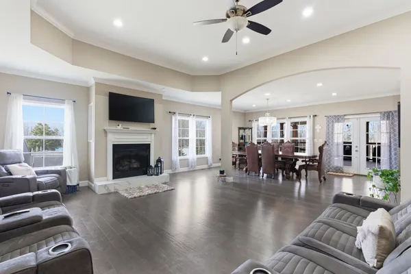 a living room with furniture fireplace and flat screen tv
