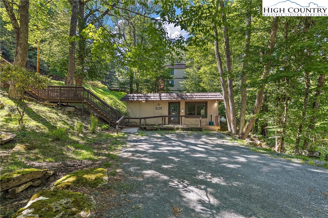 101 Mid Holiday Lane, Unit E217 Beech Mountain, NC 28604 - Photo 30 of 43 a view of a house with a tree
