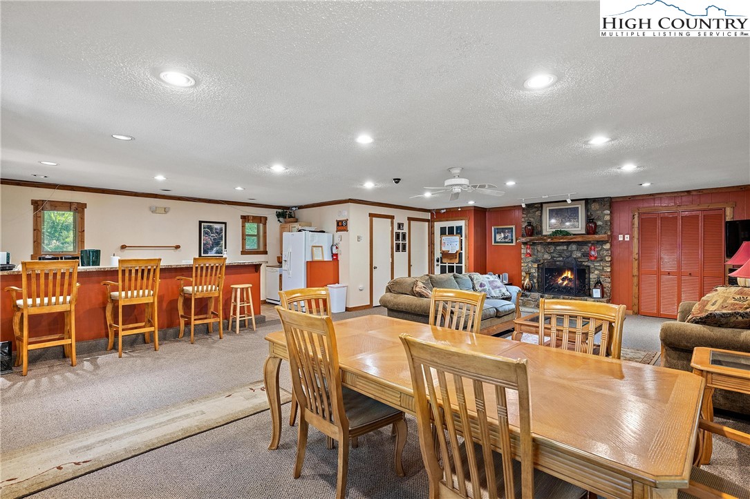 101 Mid Holiday Lane, Unit E217 Beech Mountain, NC 28604 - Photo 31 of 43 a view of a dining room with furniture