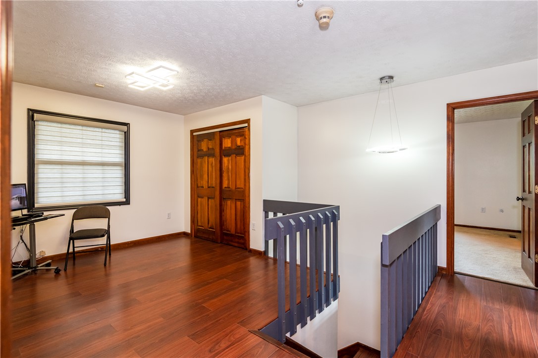 6750 Little Twin Road Germantown, OH 45327 - Photo 24 of 88 This interior space features rich wood flooring, ample natural light, and classic architectural elements.