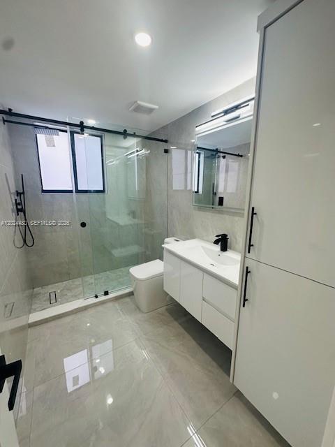 11870 Southwest 5th Street, Unit A Miami, FL 33184 - Photo 8 of 18 a bathroom with a white tub shower and sink