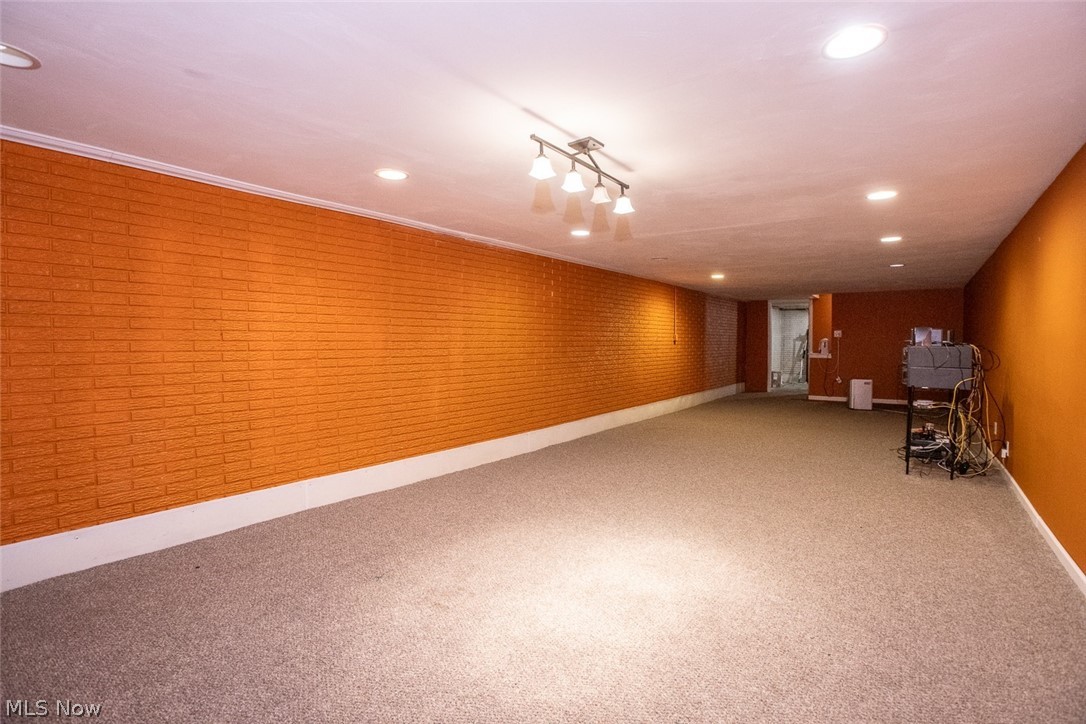 7075 Valley View Road Hudson, OH 44236 - Photo 14 of 17 Perfect for entertaining, the basement features carpet floors and track lighting