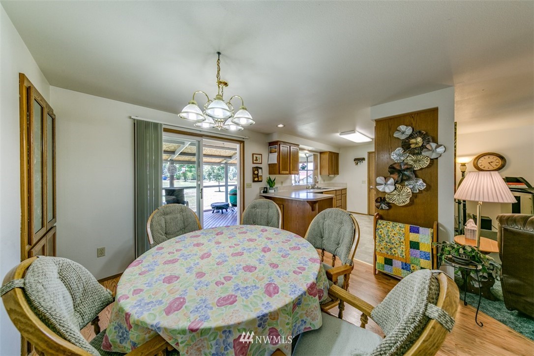 422 Hulse Road Port Angeles, WA 98362 - Photo 11 of 40 a view of a dining room with furniture and chandelier