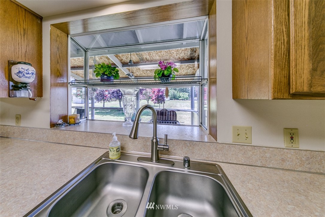 422 Hulse Road Port Angeles, WA 98362 - Photo 15 of 40 a kitchen with a sink and a window