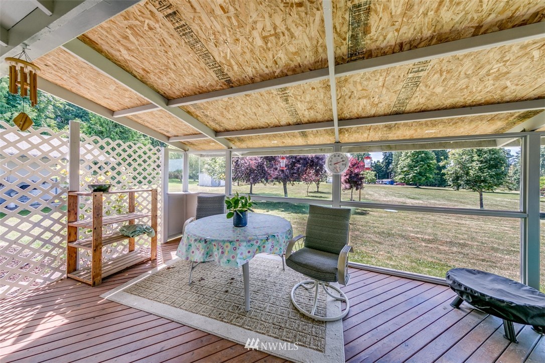 422 Hulse Road Port Angeles, WA 98362 - Photo 18 of 40 a patio with glass table and chairs