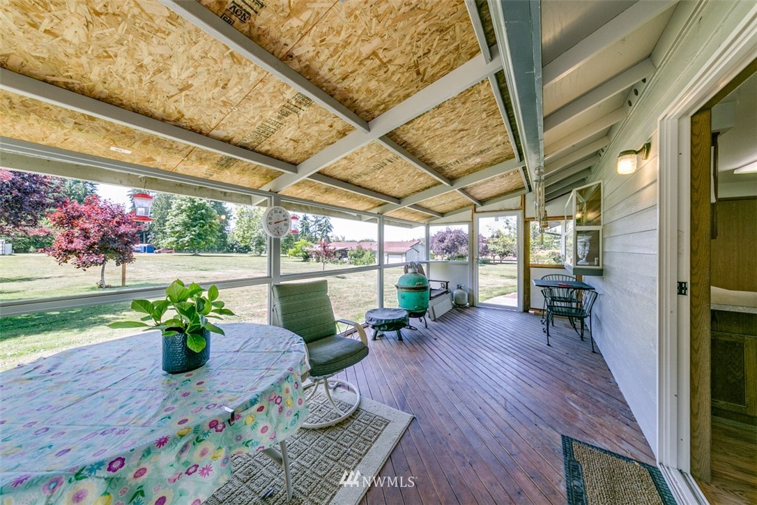 422 Hulse Road Port Angeles, WA 98362 - Photo 19 of 40 a view of a porch with furniture and a potted plant