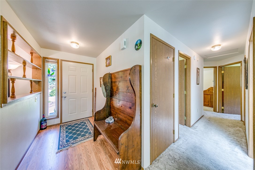 422 Hulse Road Port Angeles, WA 98362 - Photo 21 of 40 a view of a hallway with wooden floor and door