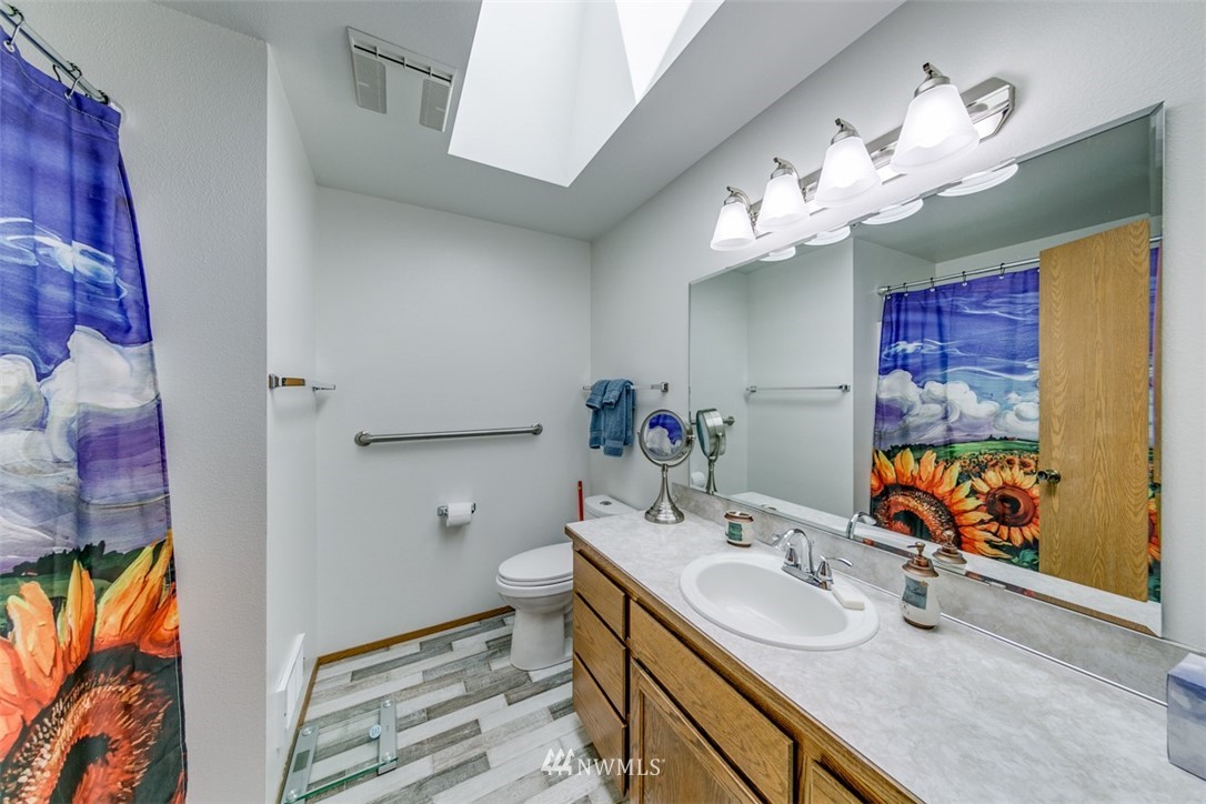 422 Hulse Road Port Angeles, WA 98362 - Photo 22 of 40 a bathroom with a sink double vanity and a mirror