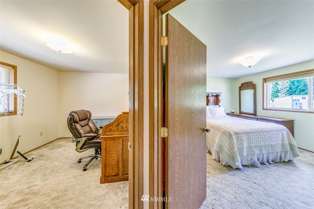 422 Hulse Road Port Angeles, WA 98362 - Photo 25 of 40 a bedroom with furniture and a window