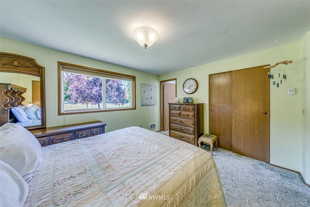 422 Hulse Road Port Angeles, WA 98362 - Photo 28 of 40 a bed room with a bed and a television