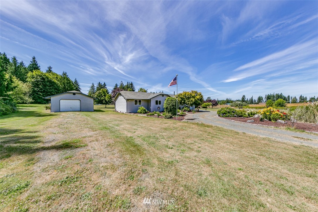 422 Hulse Road Port Angeles, WA 98362 - Photo 32 of 40 a front view of a house with a yard and potted plants