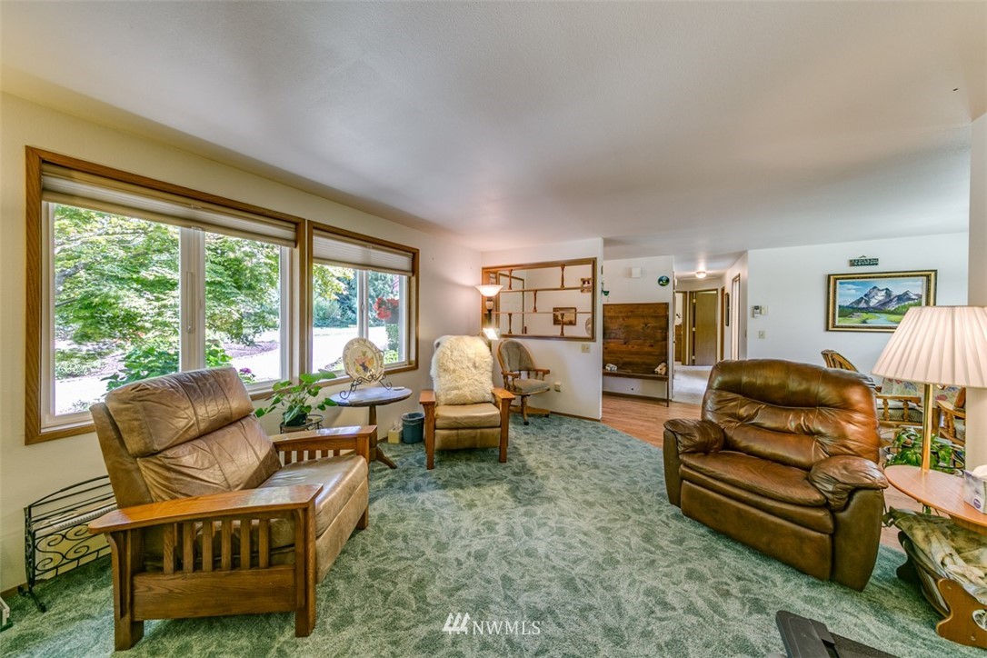 422 Hulse Road Port Angeles, WA 98362 - Photo 9 of 40 a living room with furniture and a large window