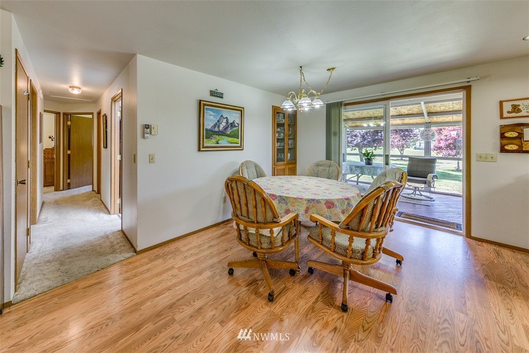 422 Hulse Road Port Angeles, WA 98362 - Photo 10 of 40 a view of a dining room with furniture window and wooden floor