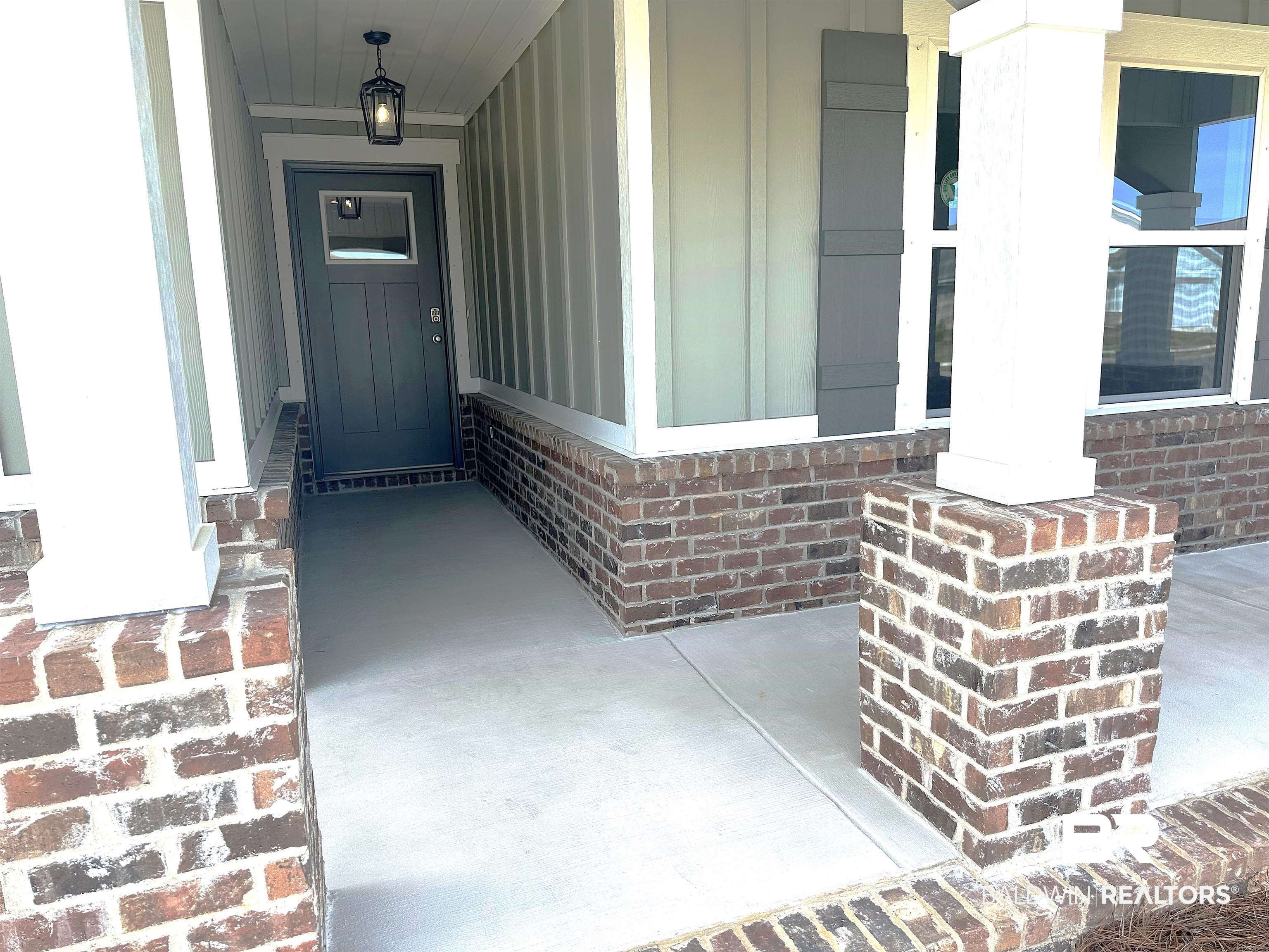 1227 Hayward Loop Foley, AL 36535 - Photo 2 of 29 View of exterior entry with covered porch