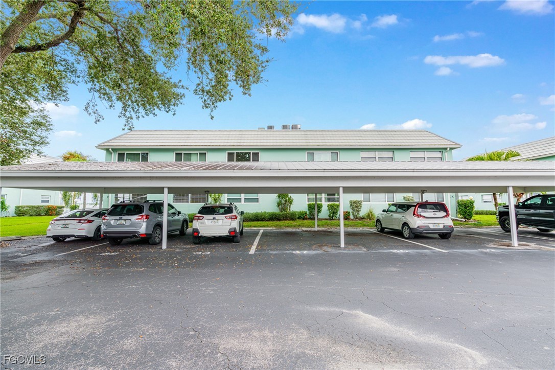 3225 East Riverside Drive, Unit 34C Fort Myers, FL 33916 - Photo 14 of 50 a view of a parking area