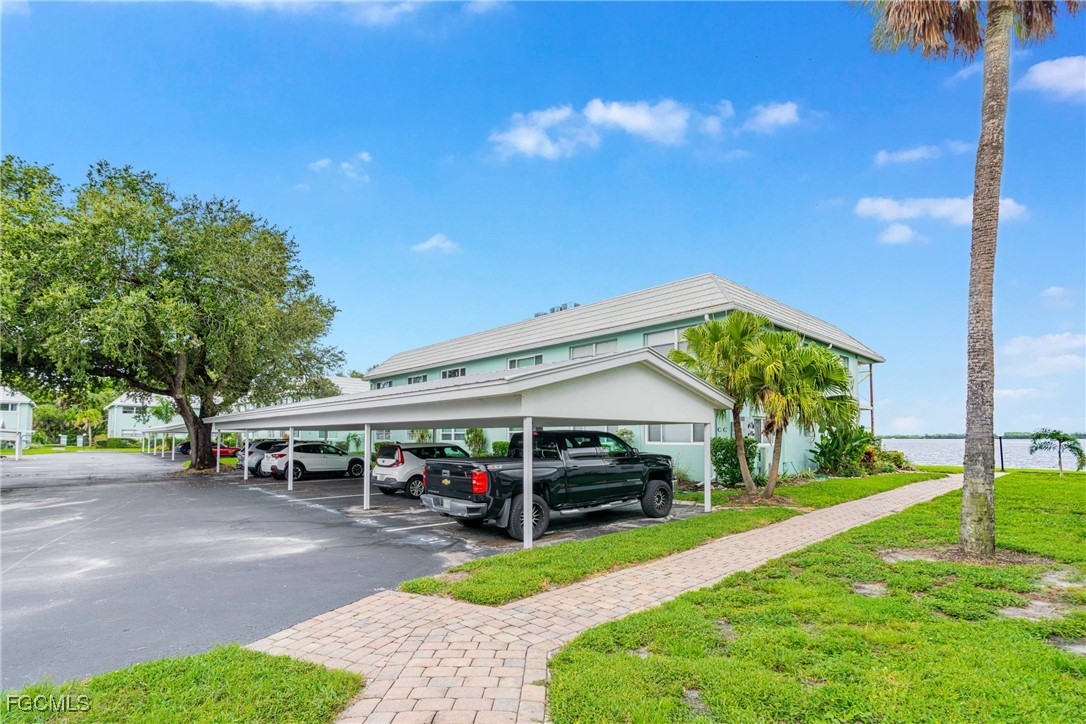 3225 East Riverside Drive, Unit 34C Fort Myers, FL 33916 - Photo 15 of 50 a view of a car park in front of house