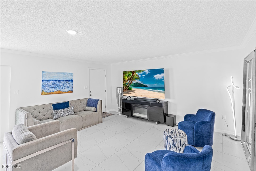 3225 East Riverside Drive, Unit 34C Fort Myers, FL 33916 - Photo 16 of 50 a living room with furniture and a flat screen tv