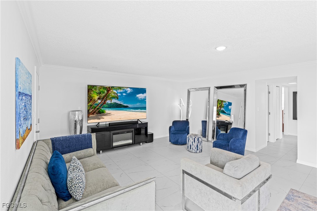 3225 East Riverside Drive, Unit 34C Fort Myers, FL 33916 - Photo 18 of 50 a living room with furniture and a flat screen tv