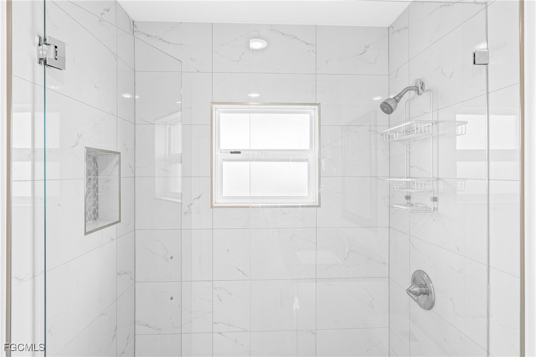3225 East Riverside Drive, Unit 34C Fort Myers, FL 33916 - Photo 30 of 50 a bathroom with a shower