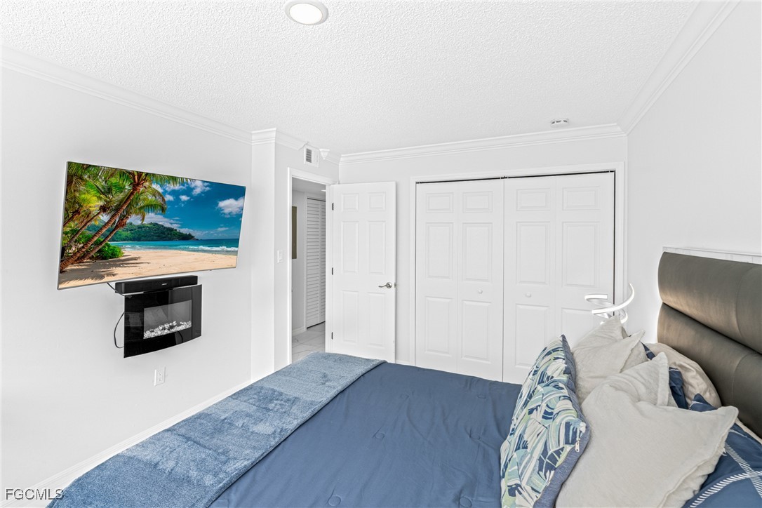 3225 East Riverside Drive, Unit 34C Fort Myers, FL 33916 - Photo 32 of 50 a living room with furniture and a flat screen tv