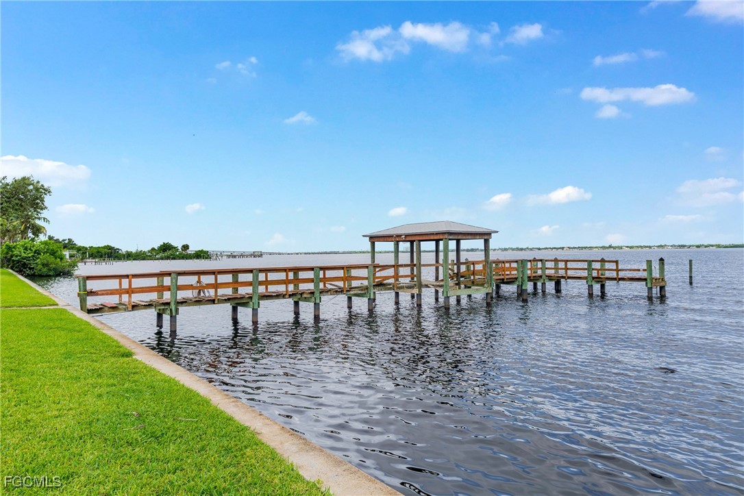 3225 East Riverside Drive, Unit 34C Fort Myers, FL 33916 - Photo 43 of 50 a view of a swimming pool with a patio